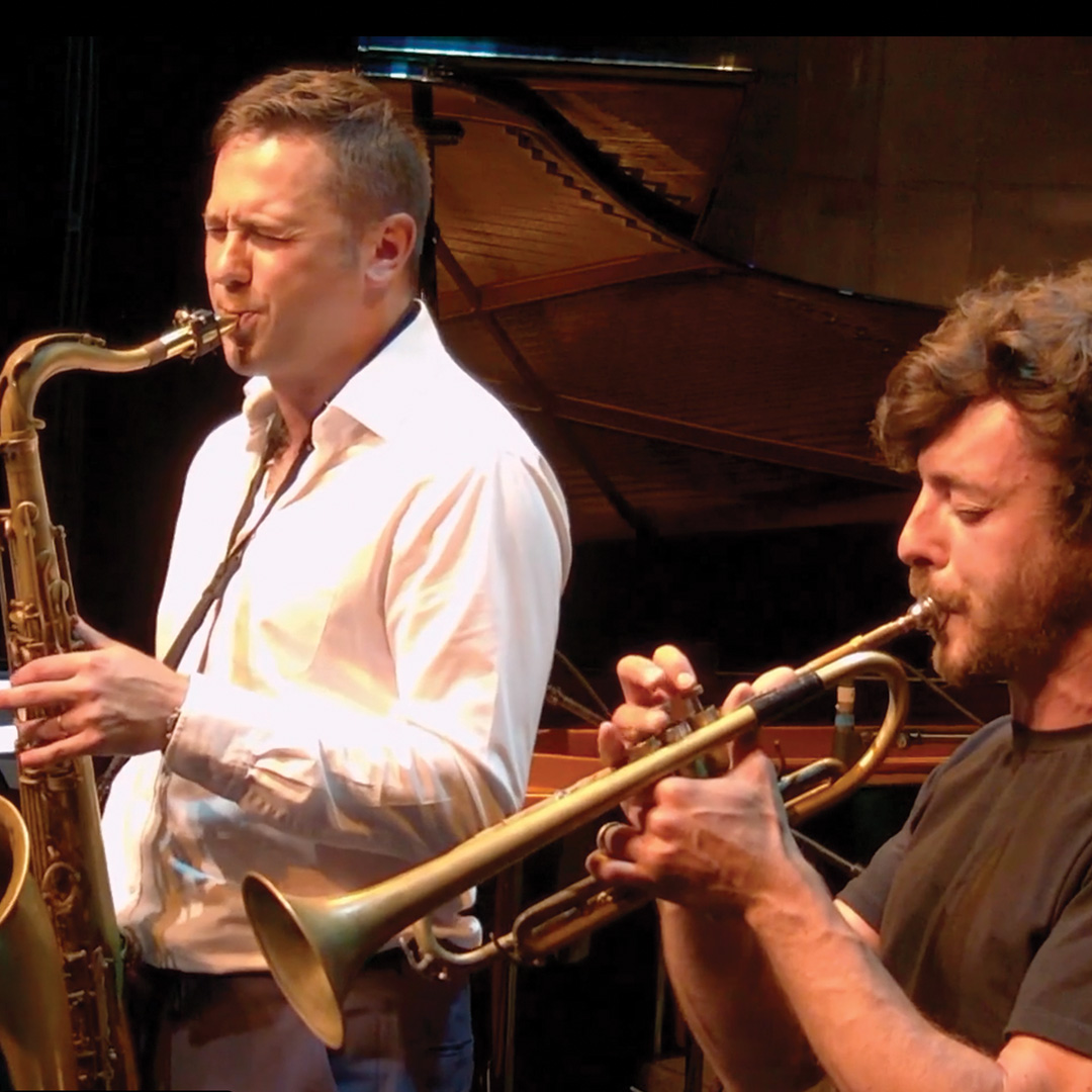 Konrad plays saxophone and Daniele plays trumpet