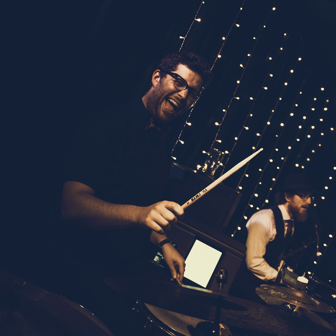 Drummer looks happy while drumming