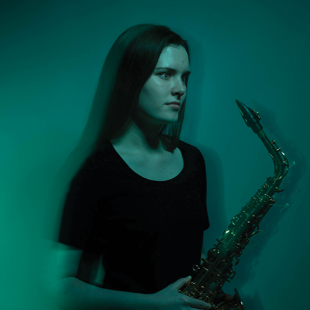 Rosalind holding her saxophone